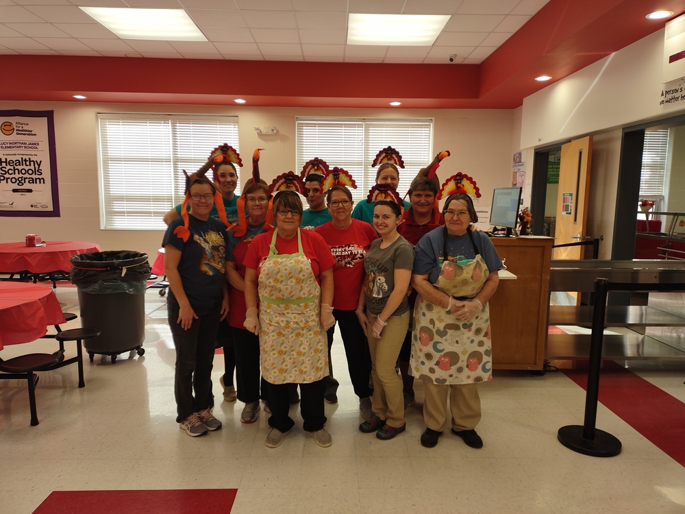 Elementary kitchen staff get ready for our Thanksgiving meal. 