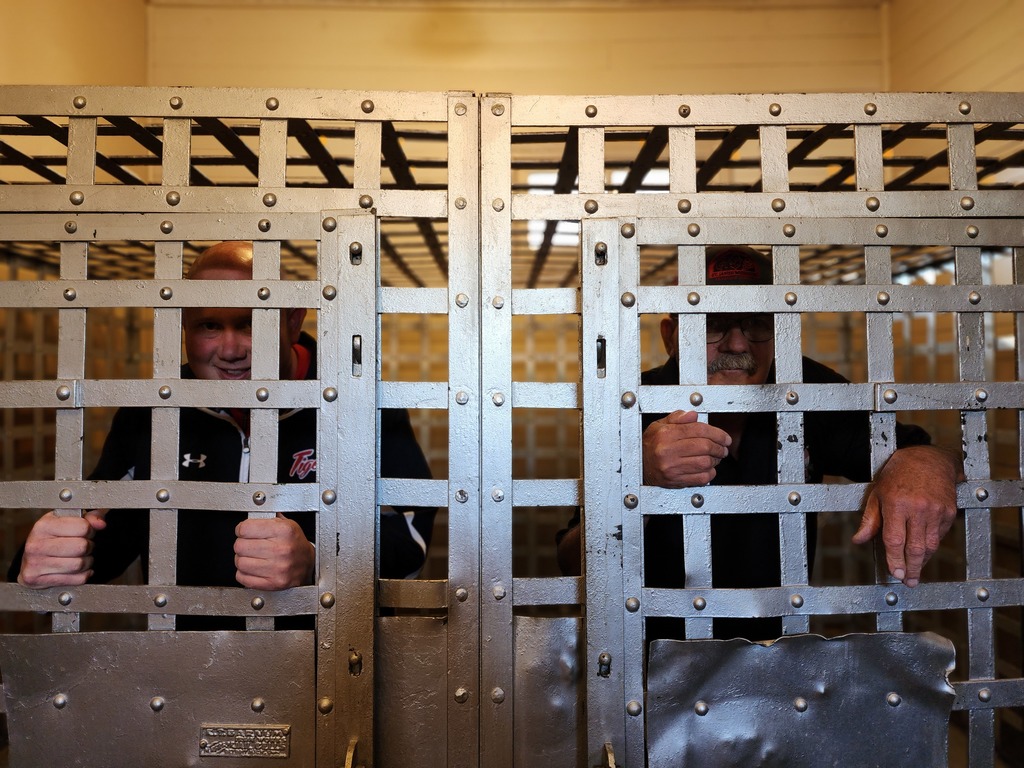 Superintendent Webster and Mayor Krawiecki are locked up in the old city hall jail cells. 