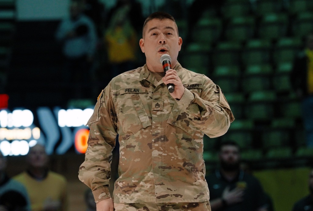 Felan sings national anthem.
