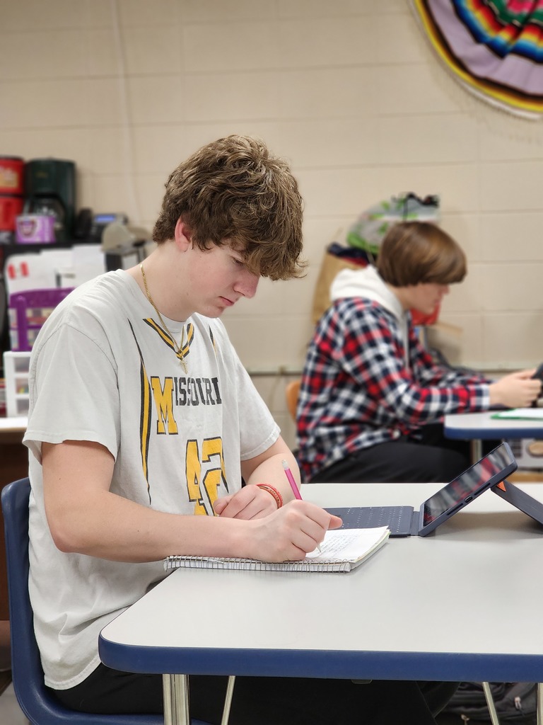 Spanish I students learn about families.