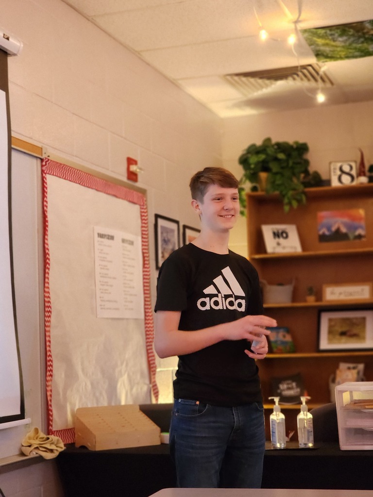Students present their Shark Tank projects.