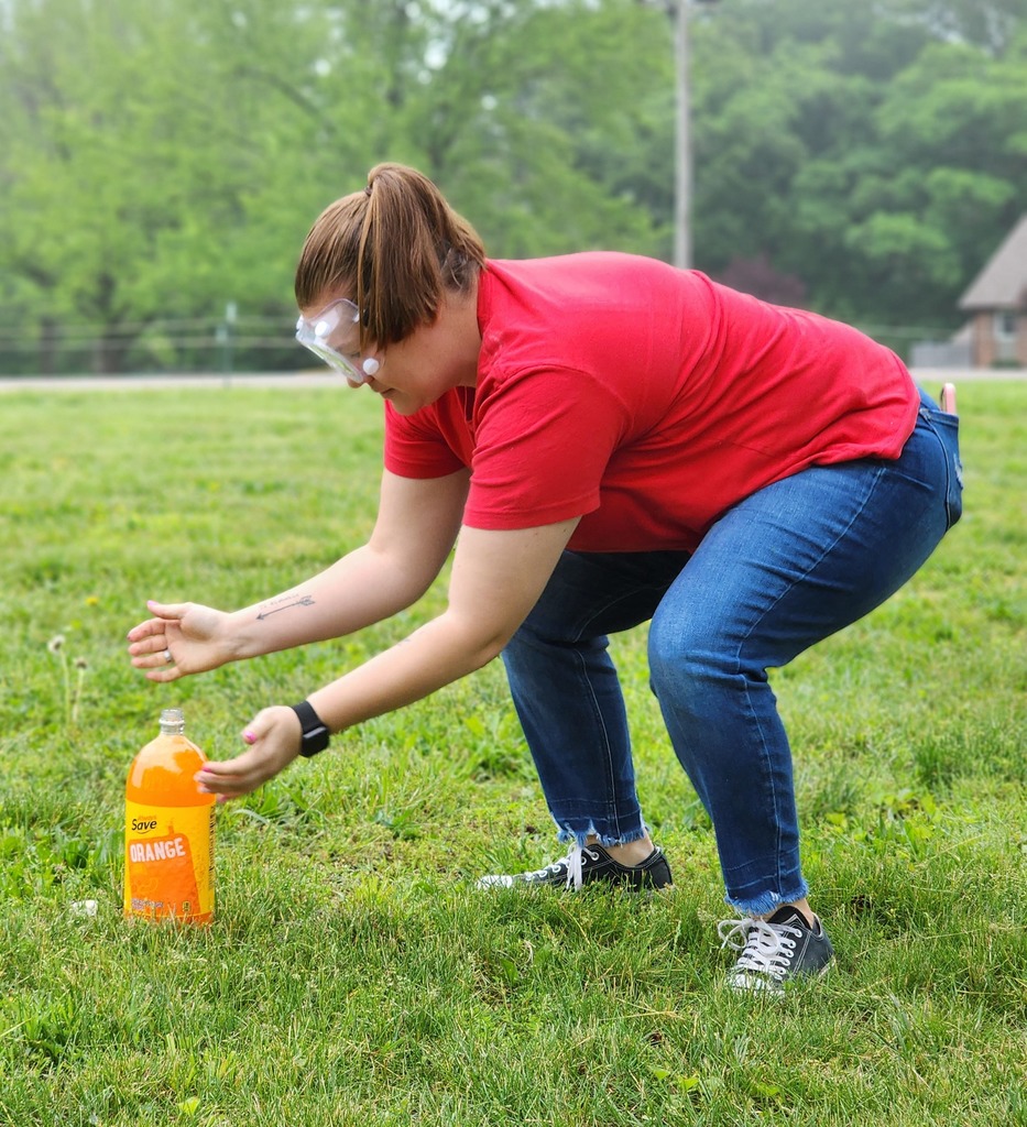 Kindergarten students conduct a science experiment for mentos versus soda.